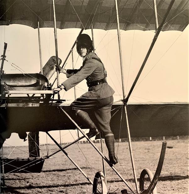 Lieutenant George Pinnock Merz climbing aboard a Bristol Boxkite aircraft. (AWM)